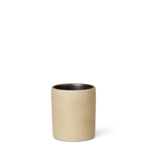 Bon Petite Cup in sand, speckled porcelain with dark glazed interior