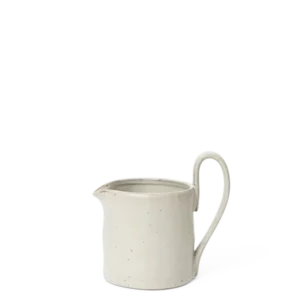 Flow Milk Jar in off-white speckle with tall curved handle and pouring spout