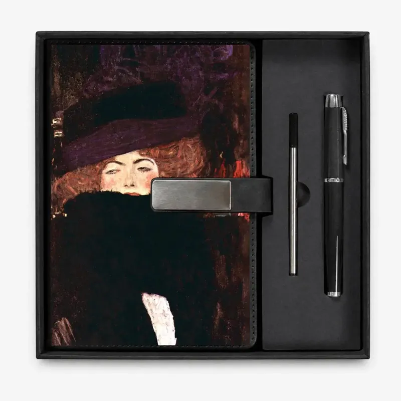 Open presentation box with the Black Lady with Hat and Feather Boa by Gustav Klimt notebook and matching refillable metal pen, gallery view 1